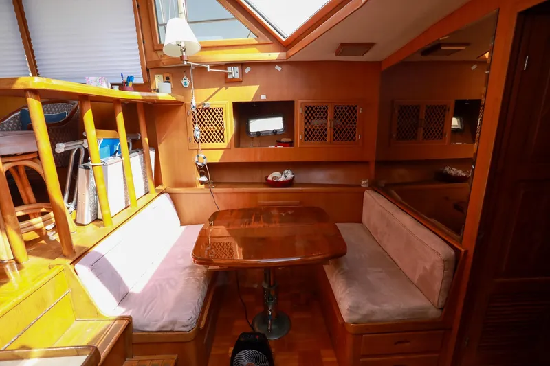 Slide: The Image of Cozy interior of 1987 Lien Hwa 47 Elegant MK III yacht with wooden dining area. - 23
