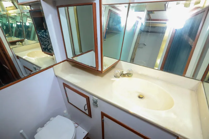 Slide: The Image of Bathroom interior of 1987 Lien Hwa 47 Elegant MK III yacht, featuring sink and mirrors. - 27