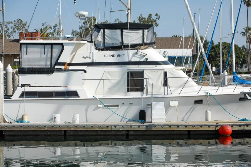 Slide: The Image of 1987 Lien Hwa 47 Elegant MK III yacht docked at marina, side view. - 3