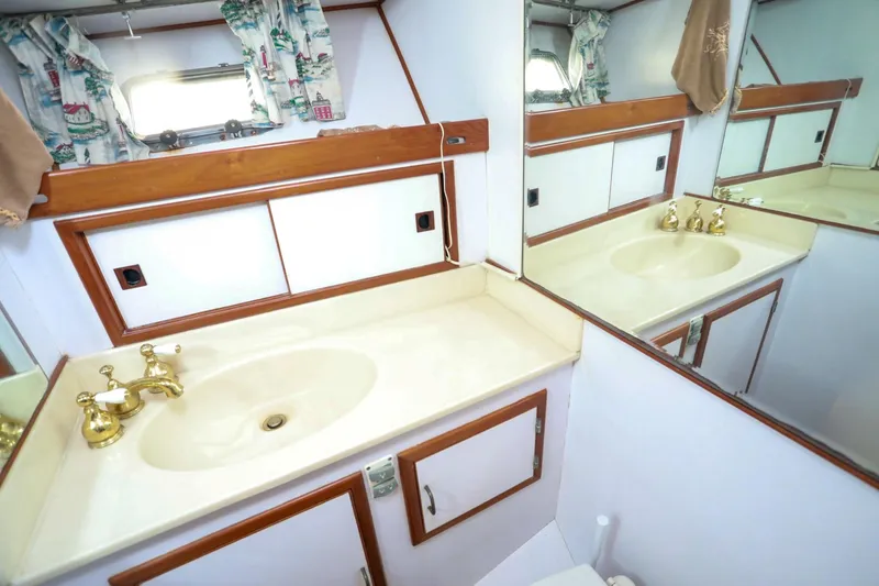 Slide: The Image of Elegant bathroom interior of 1987 Lien Hwa 47 MK III yacht with gold fixtures. - 34
