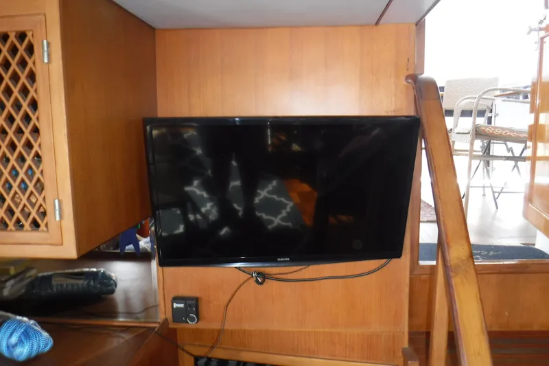 Slide: The Image of Flat-screen TV mounted on wooden interior of 1987 Lien Hwa 47 Elegant MK III yacht. - 49