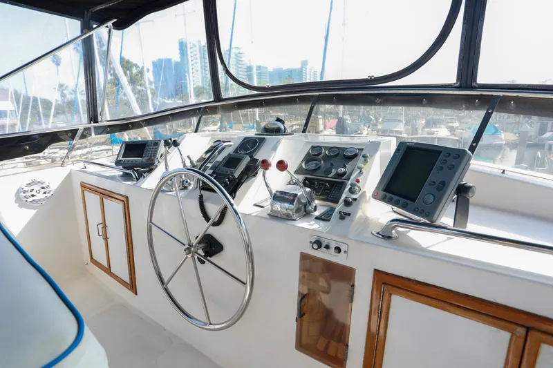 Slide: The Image of Helm of 1987 Lien Hwa 47 Elegant MK III yacht with navigation instruments and steering wheel. - 5