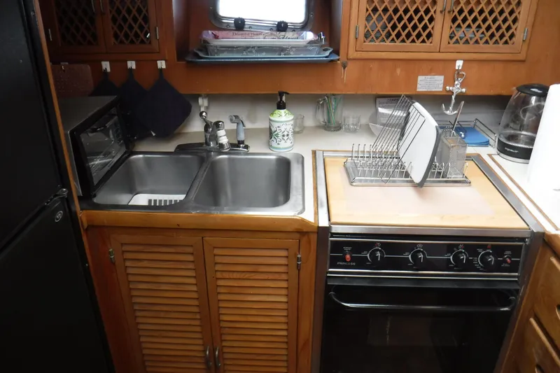 Slide: The Image of Galley kitchen in 1987 Lien Hwa 47 Elegant MK III yacht with sink and stove. - 54