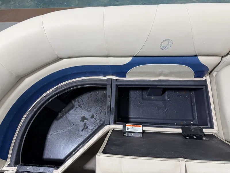 Slide: The Image of Interior view of a 2014 Lowe SS 210 boat with storage compartment. - 15