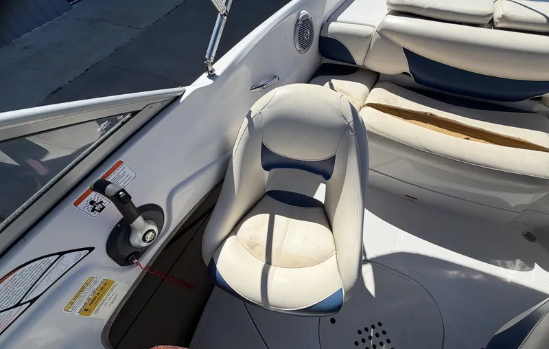 Slide: The Image of Interior of a 2013 TAHOE - WRMG Q5i boat with seat and controls. - 14