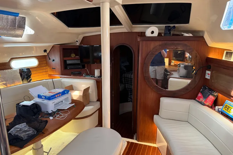 Slide: The Image of Interior of 1997 Hunter Passage 420 yacht with cozy seating and wooden finishes. - 15