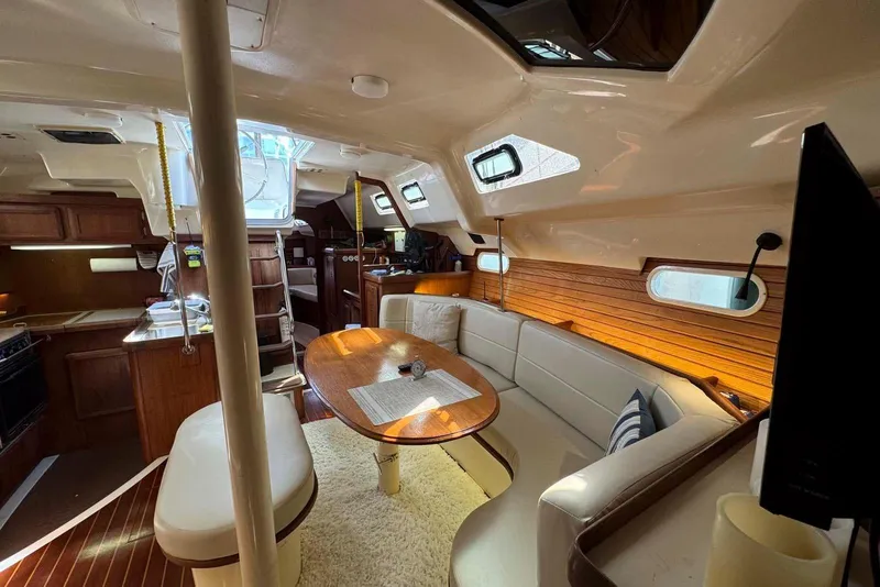 Slide: The Image of Luxurious interior seating of 1997 Hunter Passage 420 yacht with plush cushions. - 16