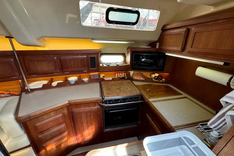 Slide: The Image of Interior of 1997 Hunter Passage 420 yacht bathroom with sink and mirror. - 18