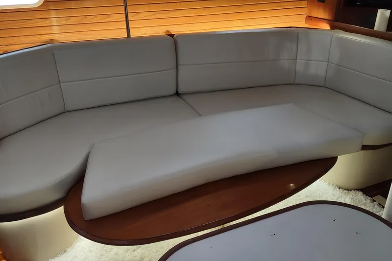 Slide: The Image of Cozy cabin interior of 1997 Hunter Passage 420 sailboat with bed and seating area. - 20