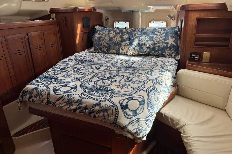 Slide: The Image of Cozy cabin interior of 1997 Hunter Passage 420 sailboat with wooden finishes. - 23
