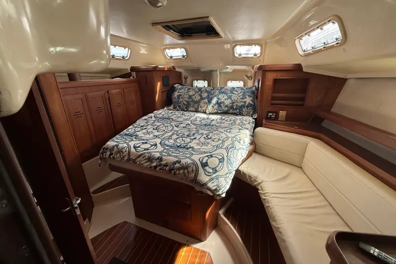 Slide: The Image of Bathroom interior of 1997 Hunter Passage 420 yacht, featuring sink and toilet. - 24