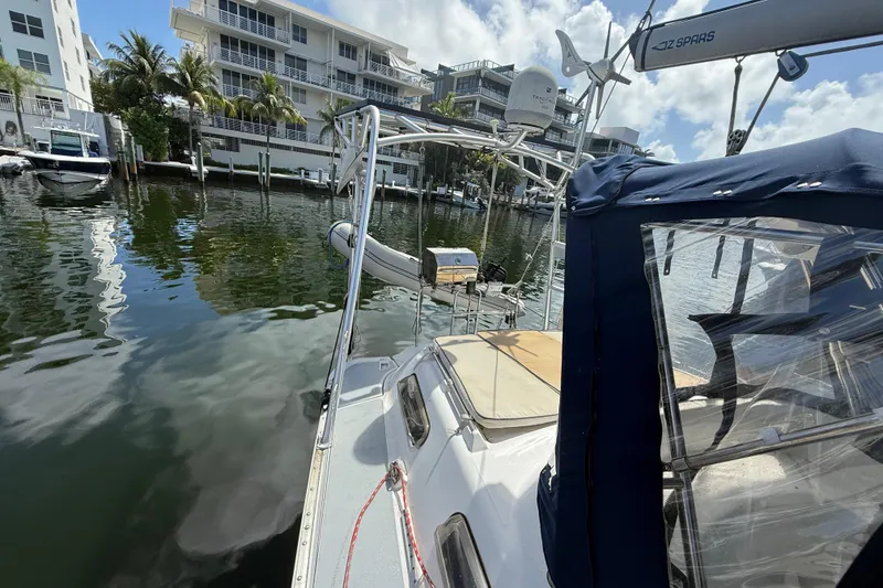 Slide: The Image of Hunter Passage 420 sailboat docked in marina, surrounded by modern buildings, 1997 model. - 6