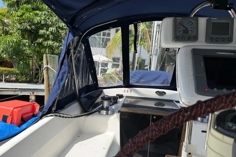 Slide: The Image of Cockpit view of 1997 Hunter Passage 420 sailboat with navigation instruments and canopy. - 9