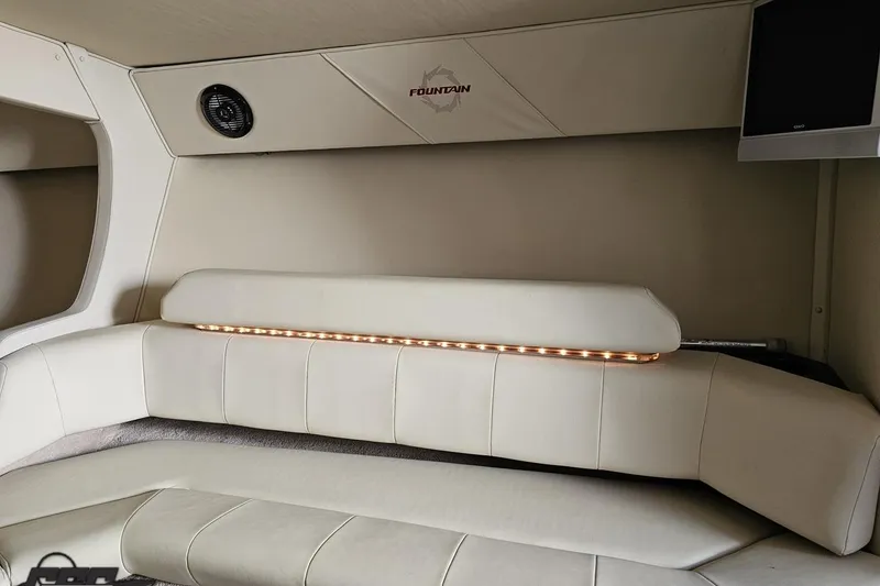 Slide: The Image of Interior of 2009 Fountain 47 Lightning boat with white leather seating and ambient lighting. - 102