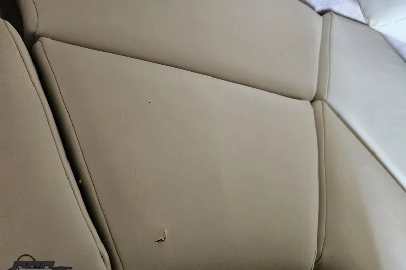 Slide: The Image of Beige leather seating in 2009 Fountain 47 Lightning boat, showing minor wear. - 103