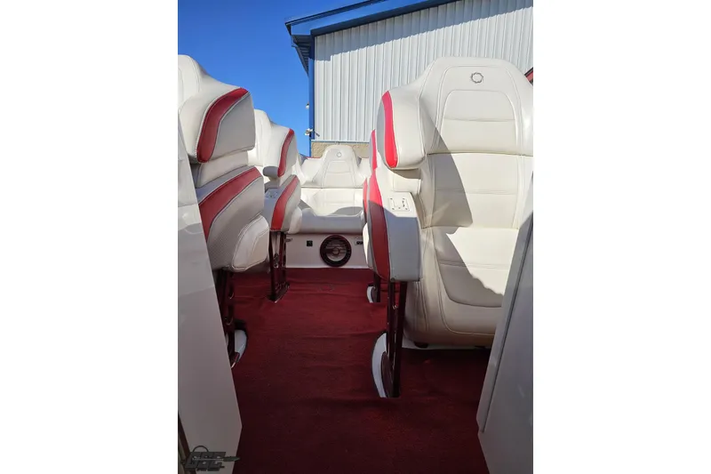 Slide: The Image of 2009 Fountain 47 Lightning boat interior with white and red seating, red carpet, and blue sky background. - 106