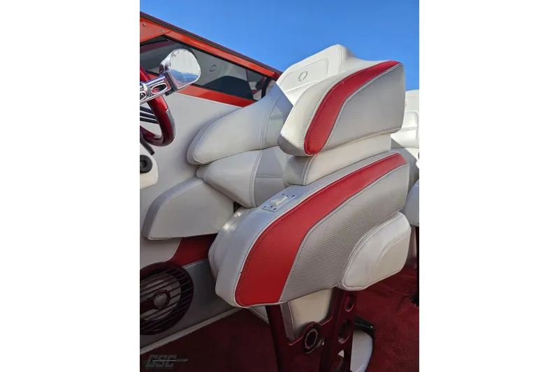 Slide: The Image of 2009 Fountain 47 Lightning boat interior with red and white seating, steering wheel detail. - 108