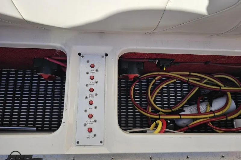 Slide: The Image of 2009 Fountain 47 Lightning boat control panel with wiring and switches. - 112
