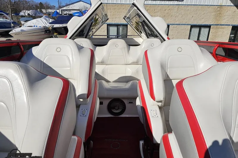 Slide: The Image of 2009 Fountain 47 Lightning boat interior with white and red seats, showcasing luxury design. - 115