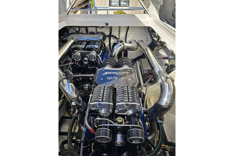 Slide: The Image of 2009 Fountain 47 Lightning engine bay with Mercury Racing 1075 engines, showcasing high-performance components. - 117