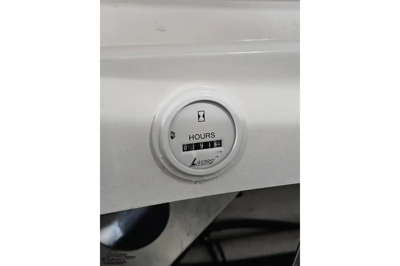 Slide: The Image of Hour meter on 2009 Fountain 47 Lightning boat dashboard, displaying usage hours. - 120