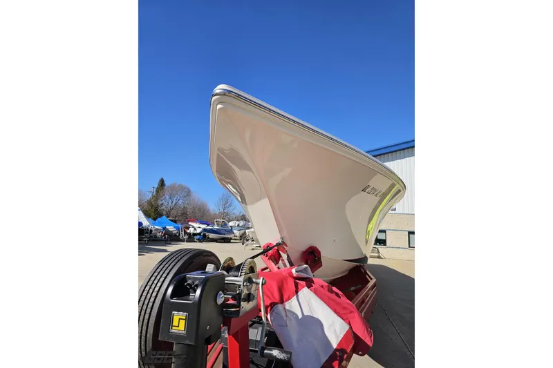 Slide: The Image of 2009 Fountain 47 Lightning boat on trailer under clear blue sky. - 16