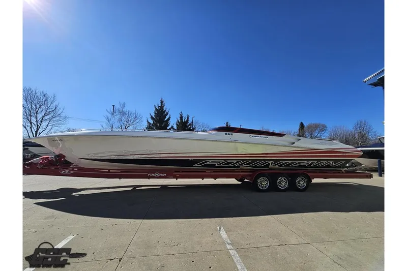 Slide: The Image of 2009 Fountain 47 Lightning speedboat on trailer under clear blue sky. - 18