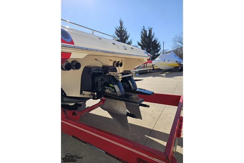 Slide: The Image of 2009 Fountain 47 Lightning boat on trailer, showcasing rear engine and propeller. - 27