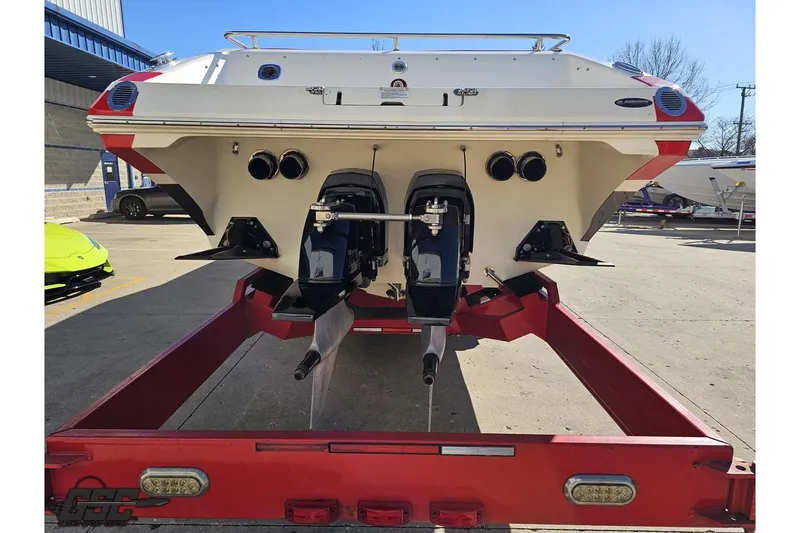 Slide: The Image of Rear view of a 2009 Fountain 47 Lightning boat on a red trailer. - 30