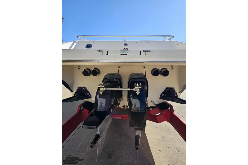 Slide: The Image of Rear view of a 2009 Fountain 47 Lightning boat with dual outboard motors. - 31