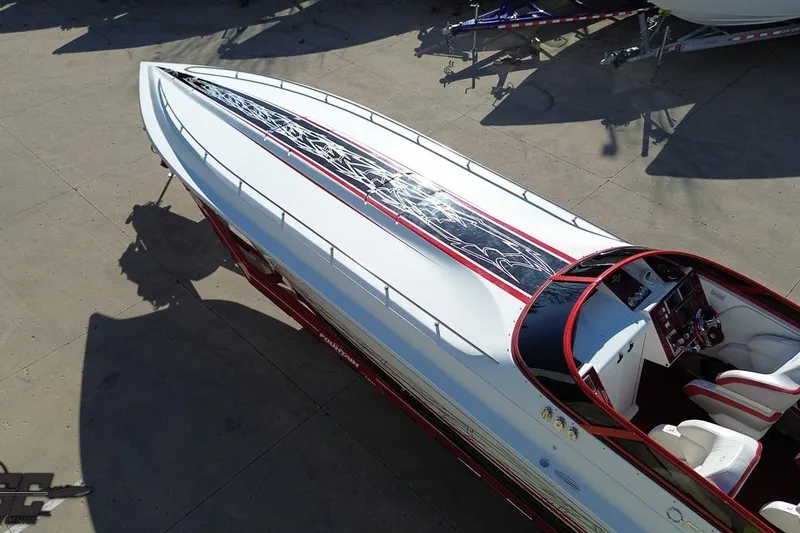 Slide: The Image of 2009 Fountain 47 Lightning speedboat with sleek design and red accents, viewed from above. - 39
