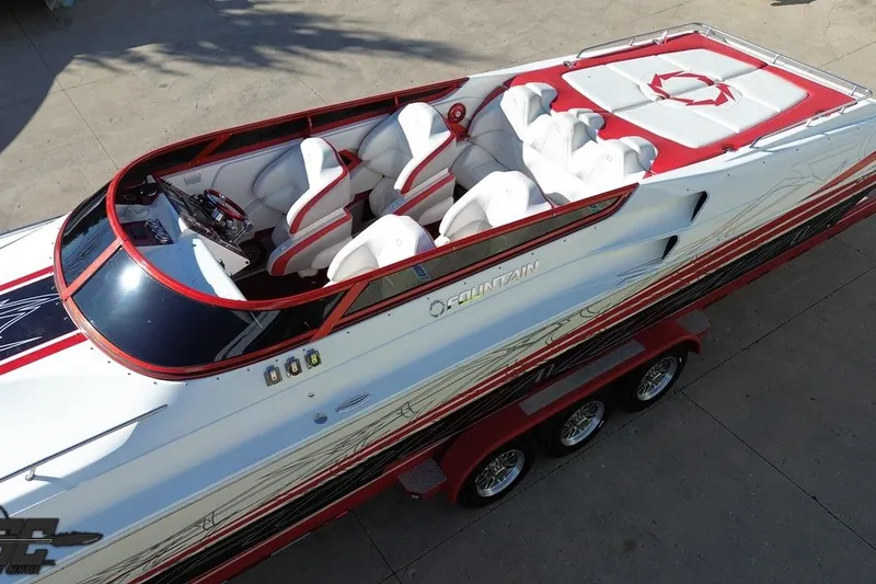 Slide: The Image of 2009 Fountain 47 Lightning speedboat with red and white design, featuring luxurious seating. - 40