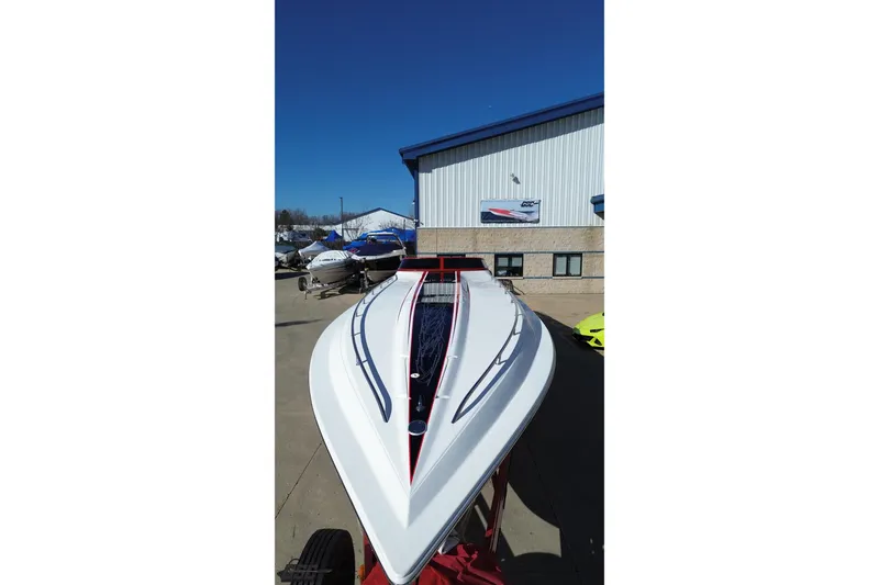 Slide: The Image of 2009 Fountain 47 Lightning boat displayed outdoors on a sunny day. - 43