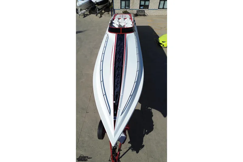 Slide: The Image of 2009 Fountain 47 Lightning boat, aerial view, sleek design, parked on concrete surface. - 44