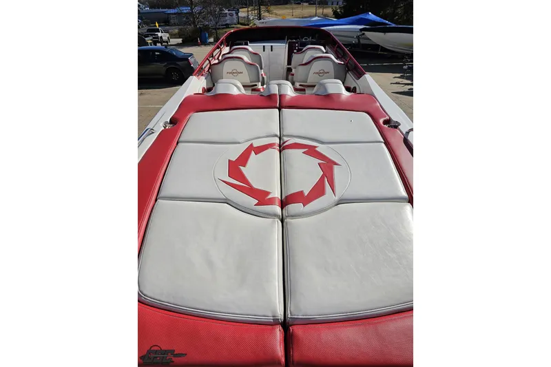 Slide: The Image of 2009 Fountain 47 Lightning boat with red and white upholstery, featuring a distinctive logo. - 50