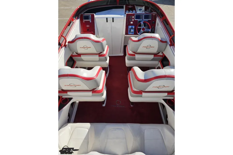 Slide: The Image of 2009 Fountain 47 Lightning boat interior with red and white seating and dashboard. - 56