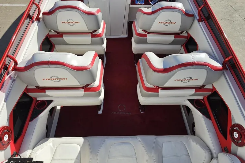 Slide: The Image of Interior of 2009 Fountain 47 Lightning boat with red and white seating. - 57