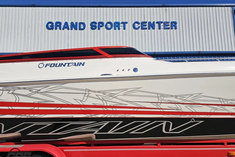 Slide: The Image of 2009 Fountain 47 Lightning boat at Grand Sport Center, featuring sleek design and graphics. - 6