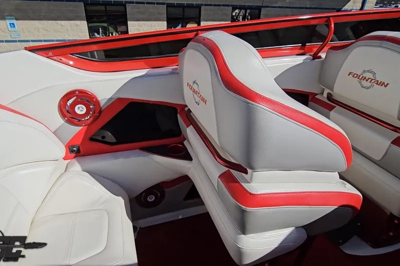 Slide: The Image of 2009 Fountain 47 Lightning boat interior with red and white seating and speaker system. - 64