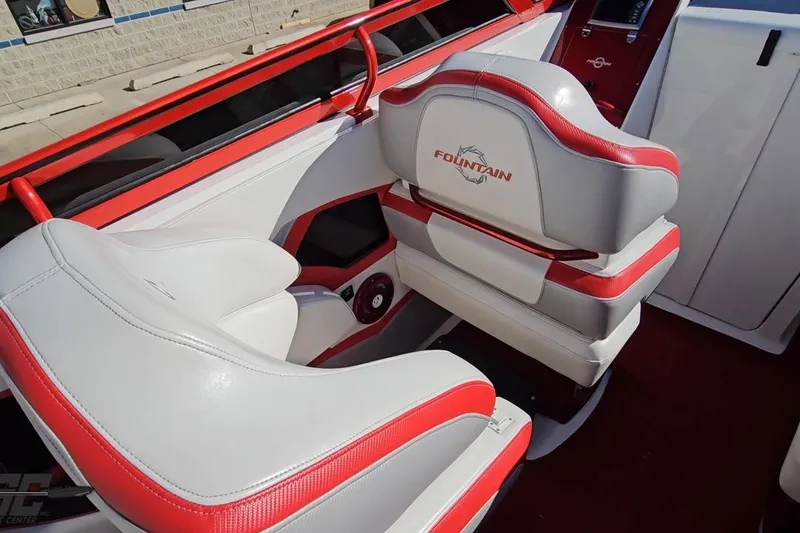 Slide: The Image of Interior of 2009 Fountain 47 Lightning boat with red and white seating. - 67