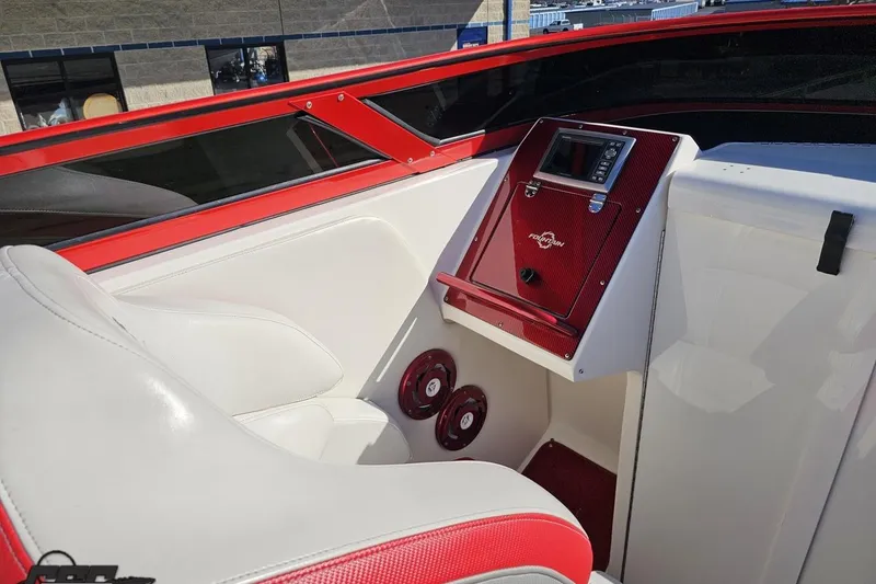 Slide: The Image of Interior of 2009 Fountain 47 Lightning boat with red and white seating and dashboard. - 70