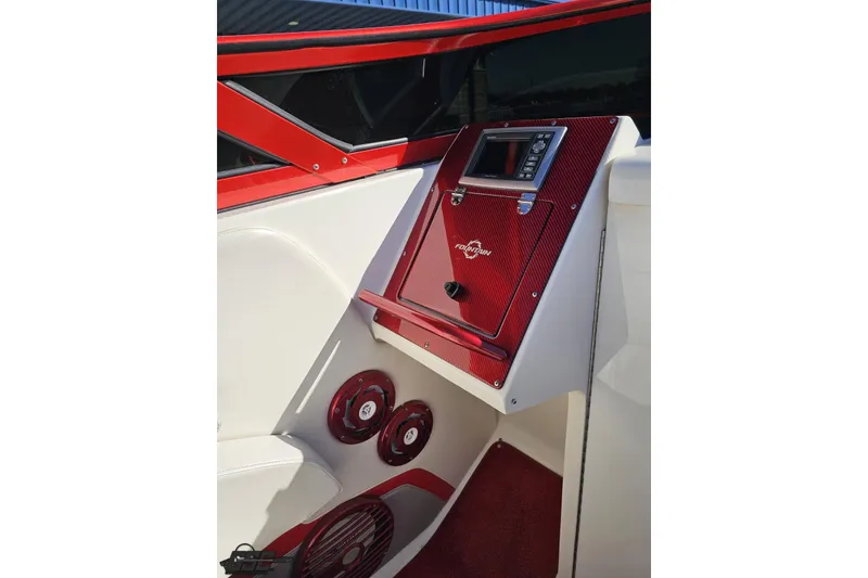 Slide: The Image of 2009 Fountain 47 Lightning boat interior with red accents and control panel. - 71