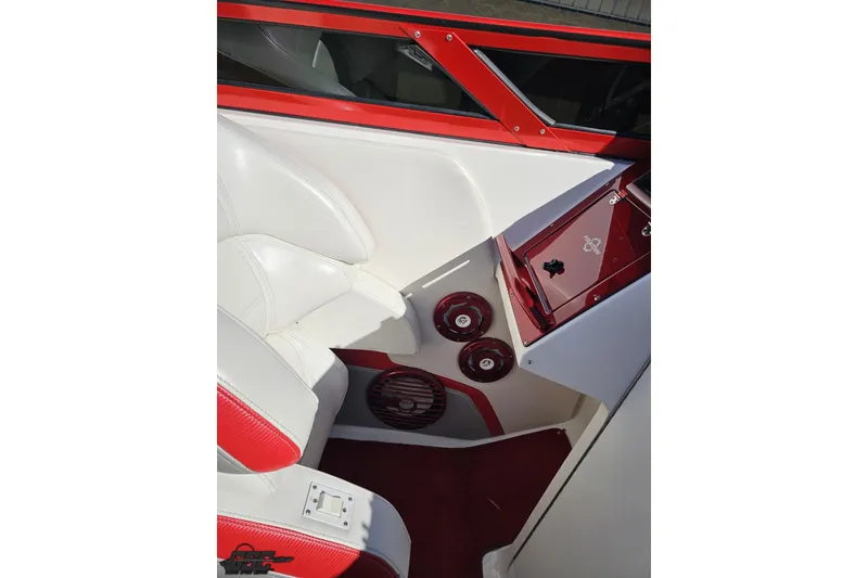 Slide: The Image of 2009 Fountain 47 Lightning boat interior with red and white seating and dashboard. - 73