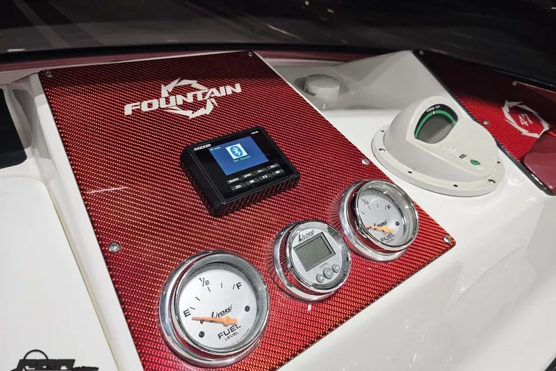 Slide: The Image of Dashboard of 2009 Fountain 47 Lightning boat with gauges and Bluetooth display. - 86