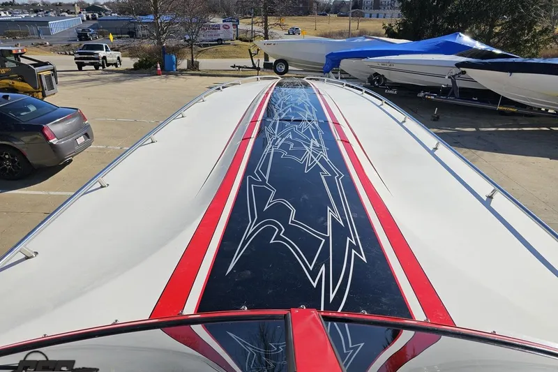Slide: The Image of 2009 Fountain 47 Lightning boat with striking red and black graphics on deck. - 87