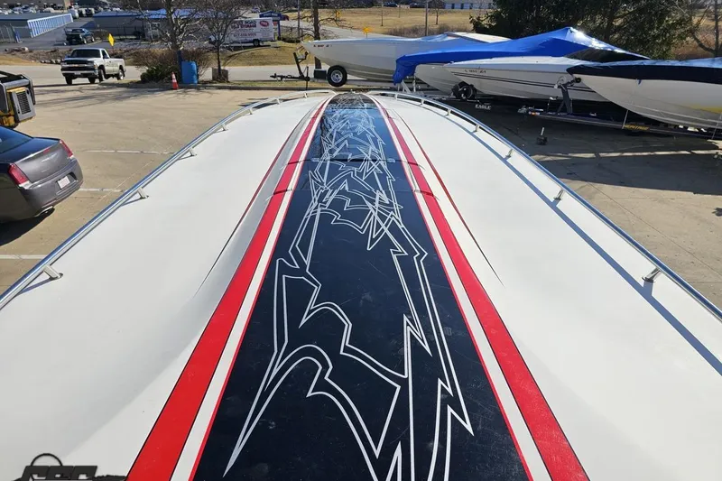 Slide: The Image of 2009 Fountain 47 Lightning boat with striking black and red deck design. - 88