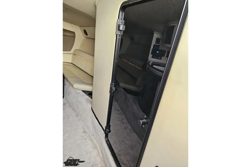 Slide: The Image of Interior of 2009 Fountain 47 Lightning boat, featuring beige seating and modern controls. - 91