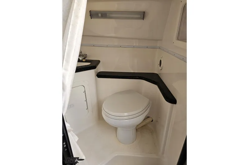 Slide: The Image of 2009 Fountain 47 Lightning boat bathroom with toilet and sink. - 93