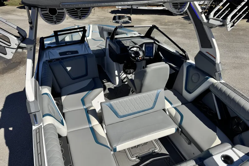 Slide: The Image of 2021 Tigé 21ZX boat interior with modern seating and advanced dashboard controls. - 14