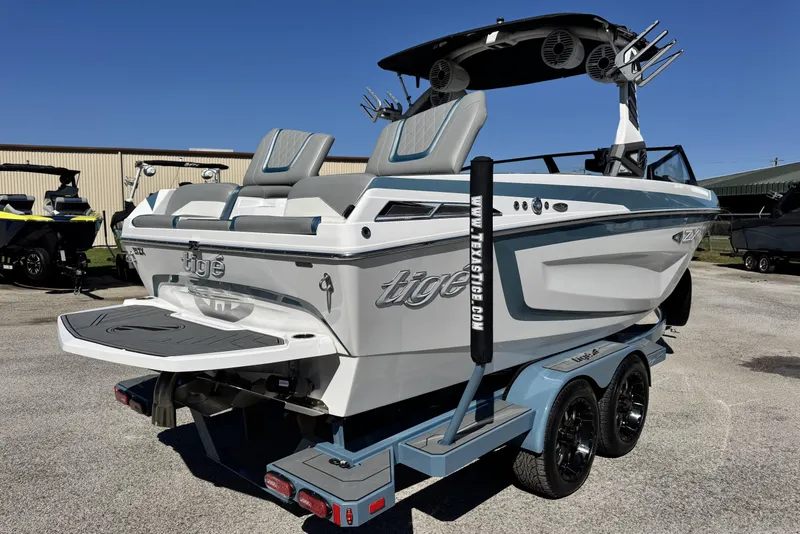 Slide: The Image of 2021 Tigé 21ZX boat on trailer, featuring sleek design and modern amenities. - 3
